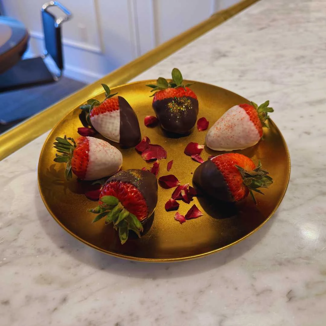 a plate of chocolate covered strawberries
