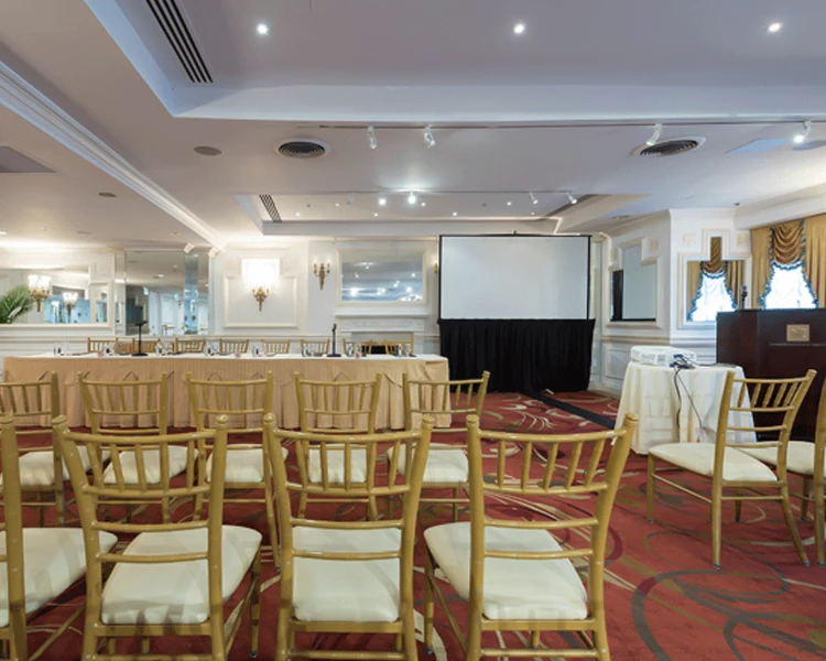 a room with chairs and a screen