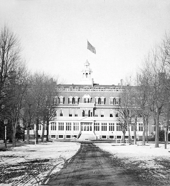 historical photo of garden city hotel with american flag
