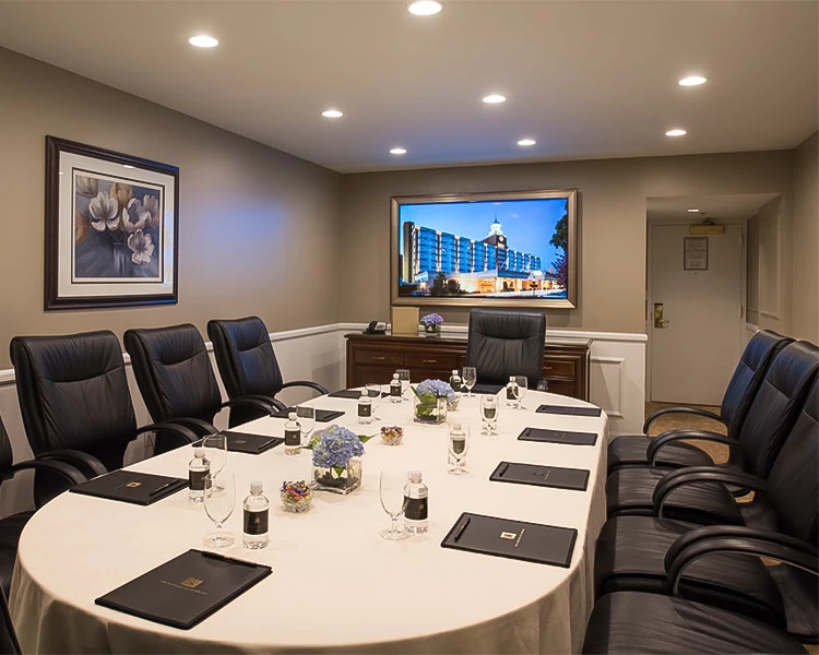 a conference room with a table and chairs