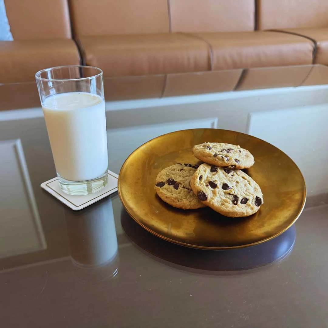 a plate of cookies and a glass of milk