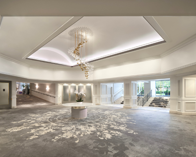 a large room with a chandelier and a round table