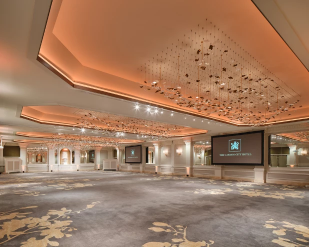 a large room with a large screen and a large ceiling