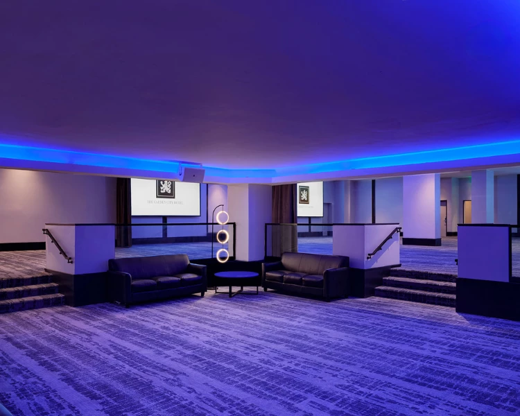 a room with couches and stairs