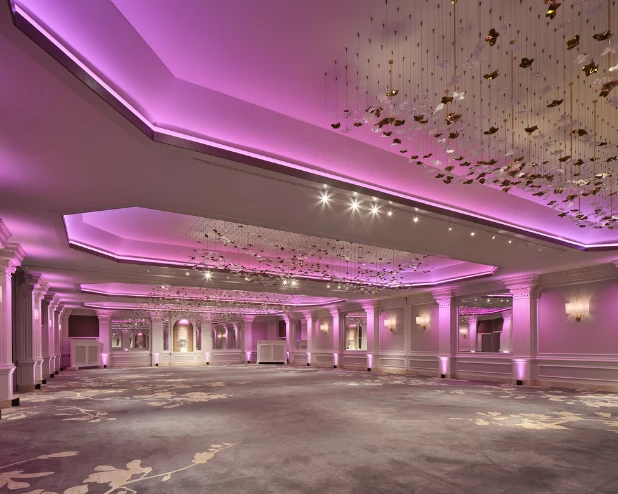 a room with pink lights and a pink ceiling