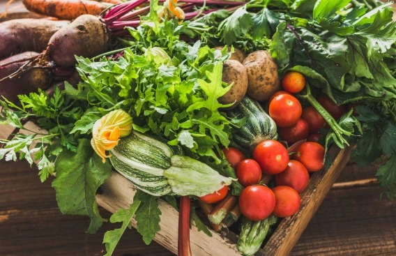 a box of vegetables and fruits