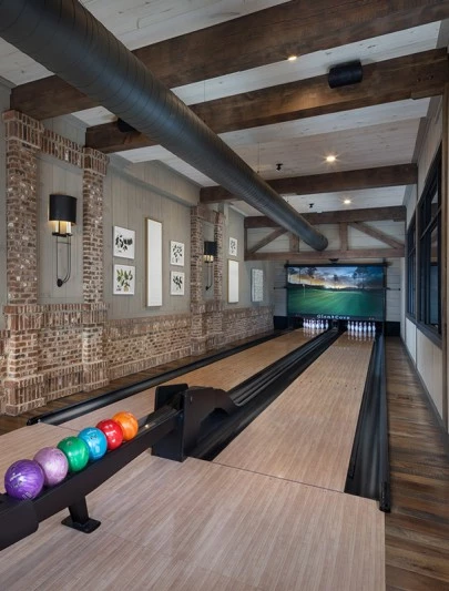 a bowling alley with balls on a rack