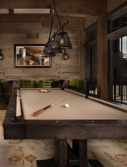a pool table with balls and a cue stick on it
