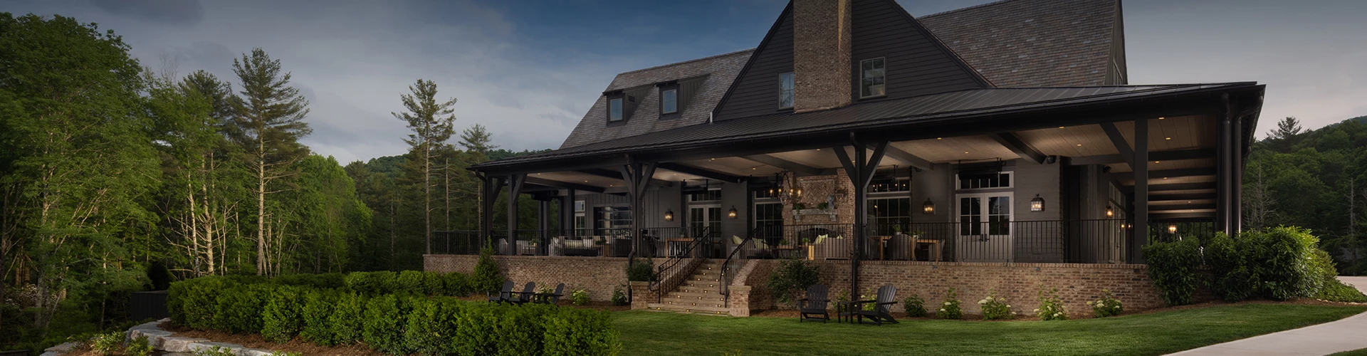 a house with a lawn and chairs