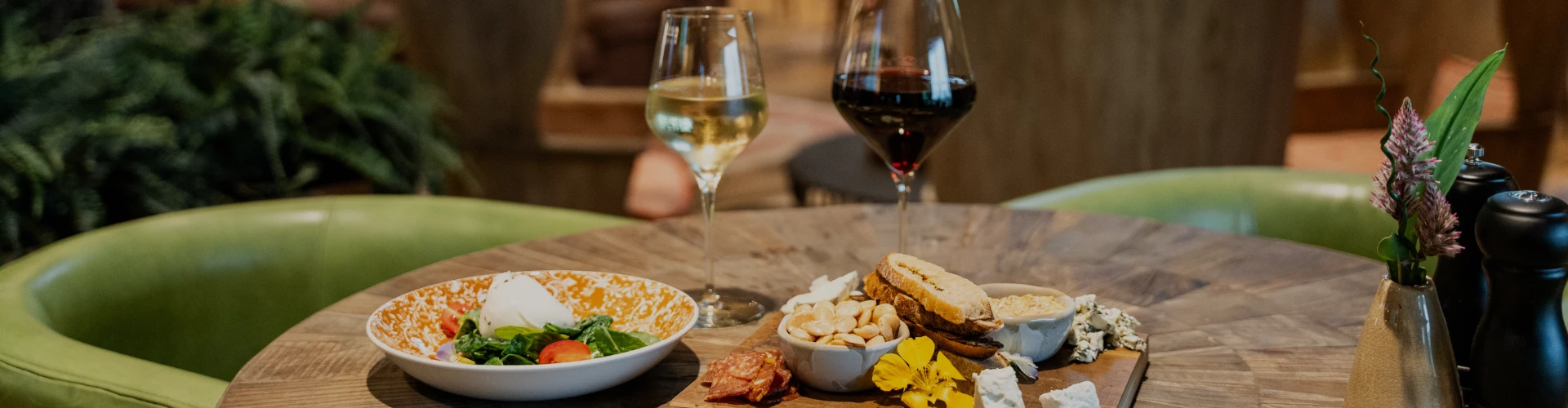 a plate of food and wine on a table