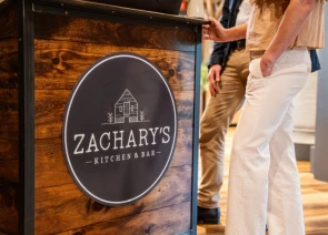 a sign on a wooden surface