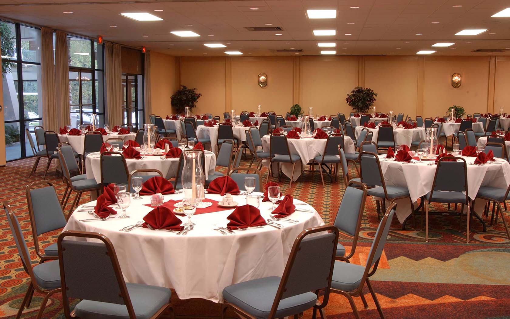 room with white table and blue chairs 