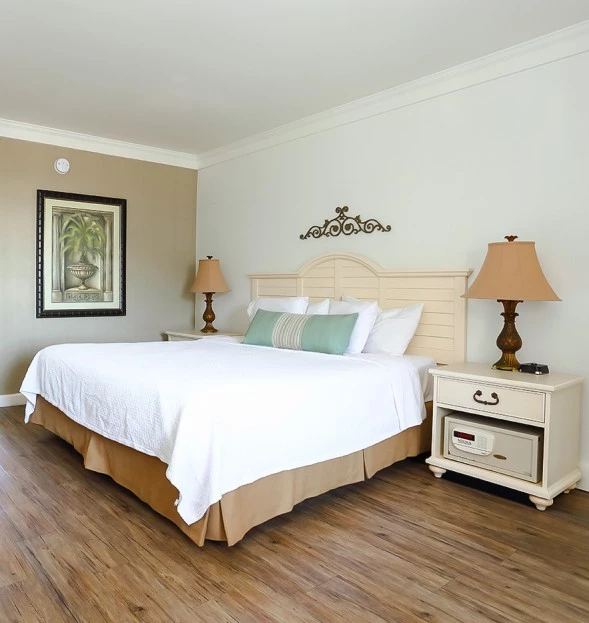 a bed with a lamp on a nightstand