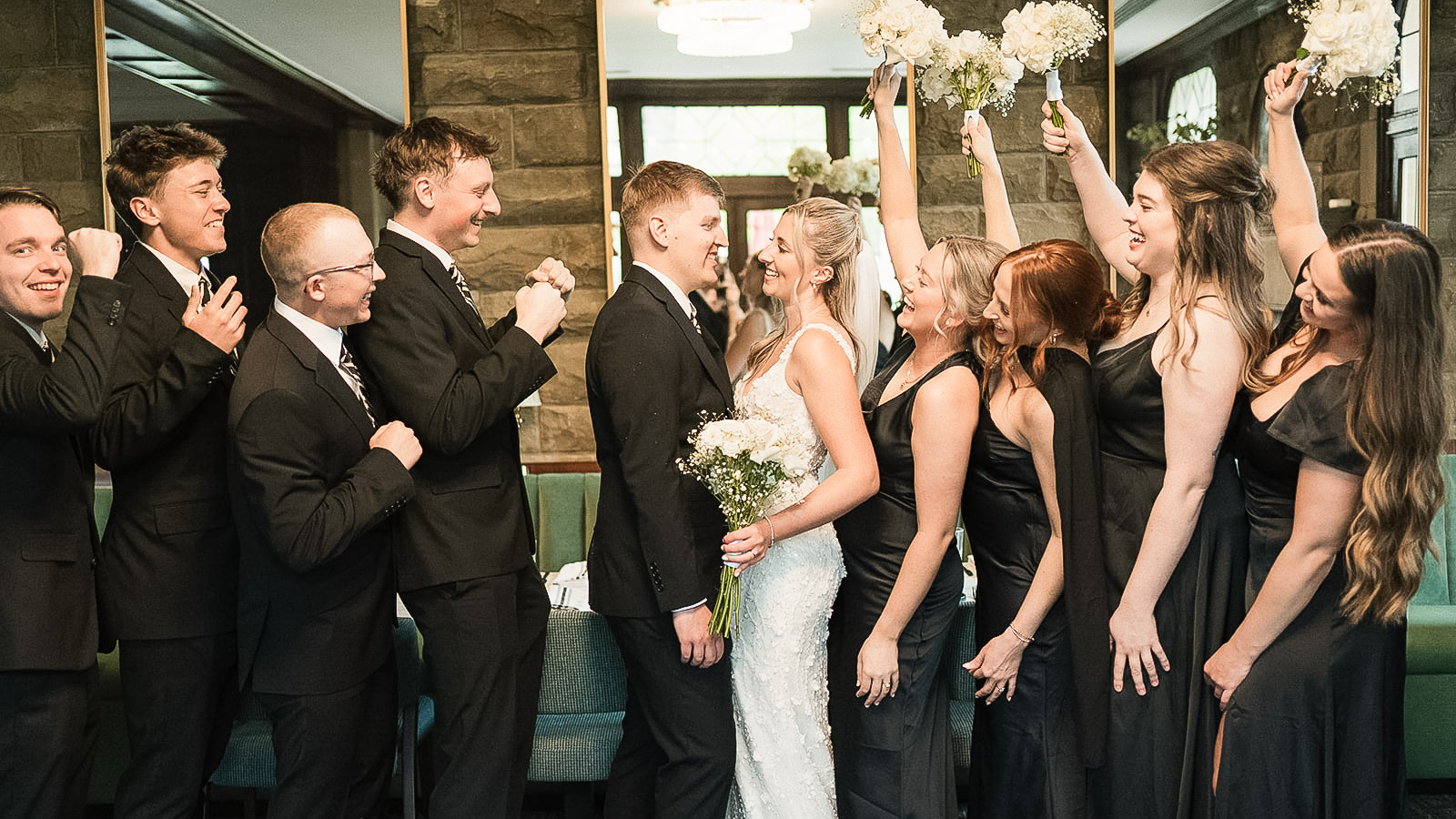 a group of people in suits and dresses