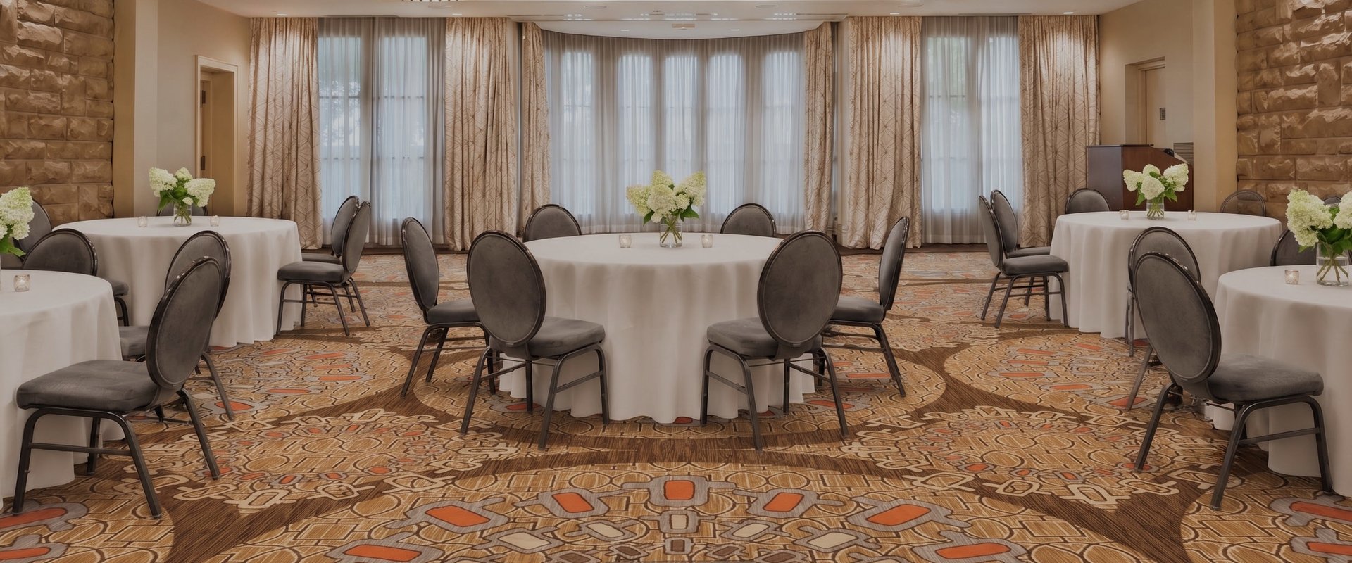 a room with a round table and chairs