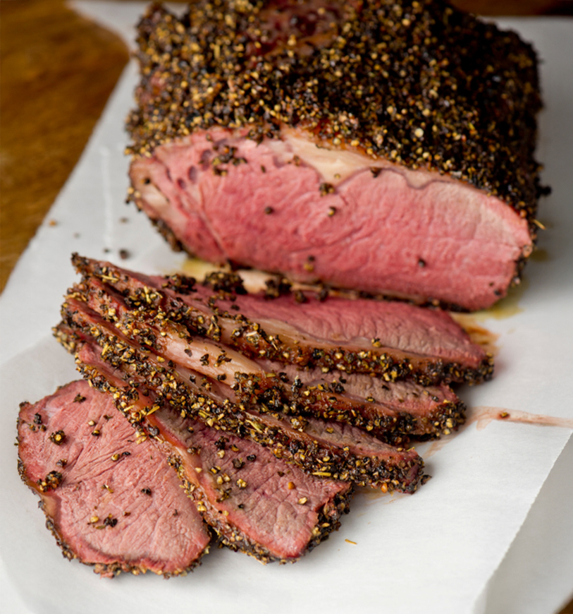 a sliced meat with spices on it