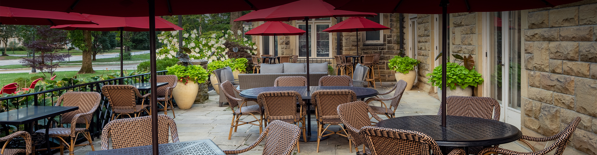 a table and chairs with umbrellas