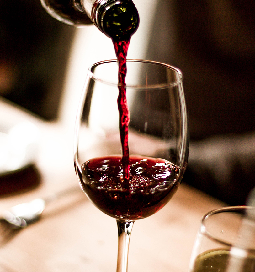 a wine being poured into a glass
