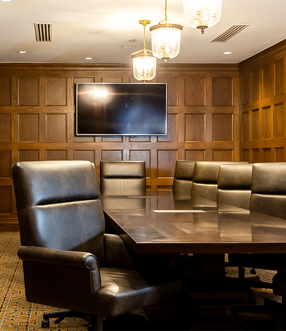 a conference room with a table and chairs