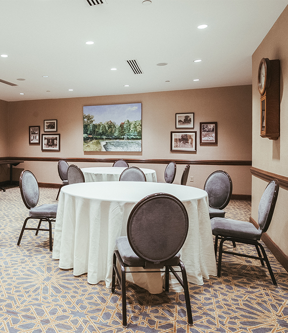 a room with round tables and chairs