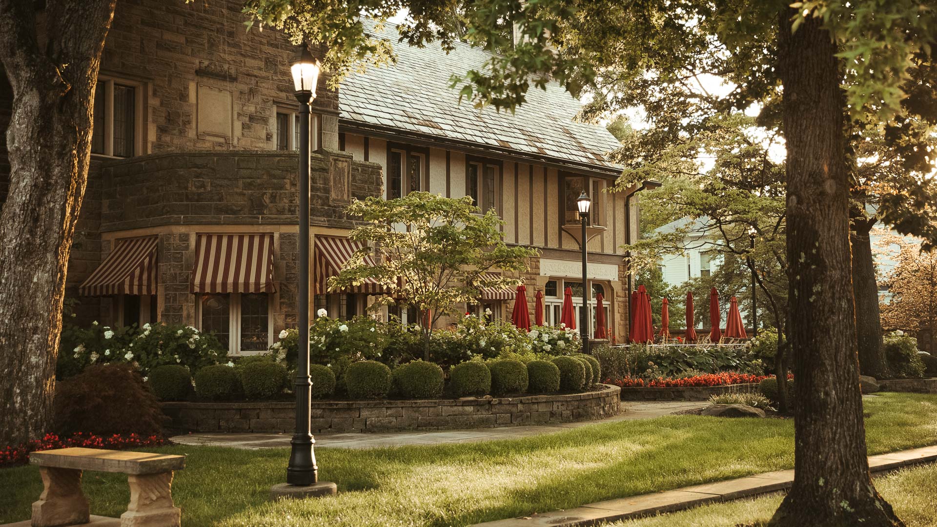 a building with a lawn and trees