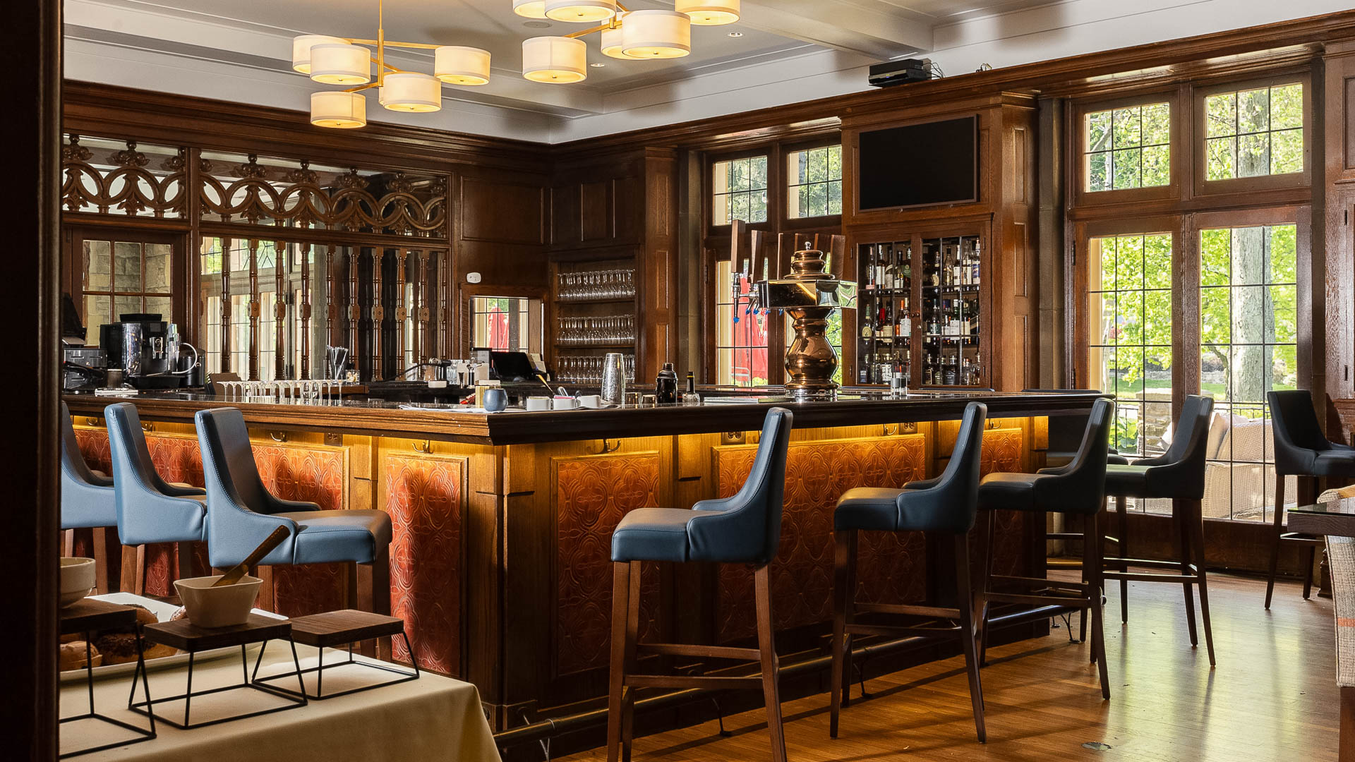 a bar with chairs and a table