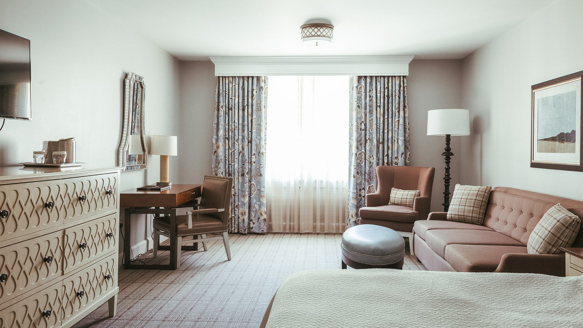 a room with a bed and a desk