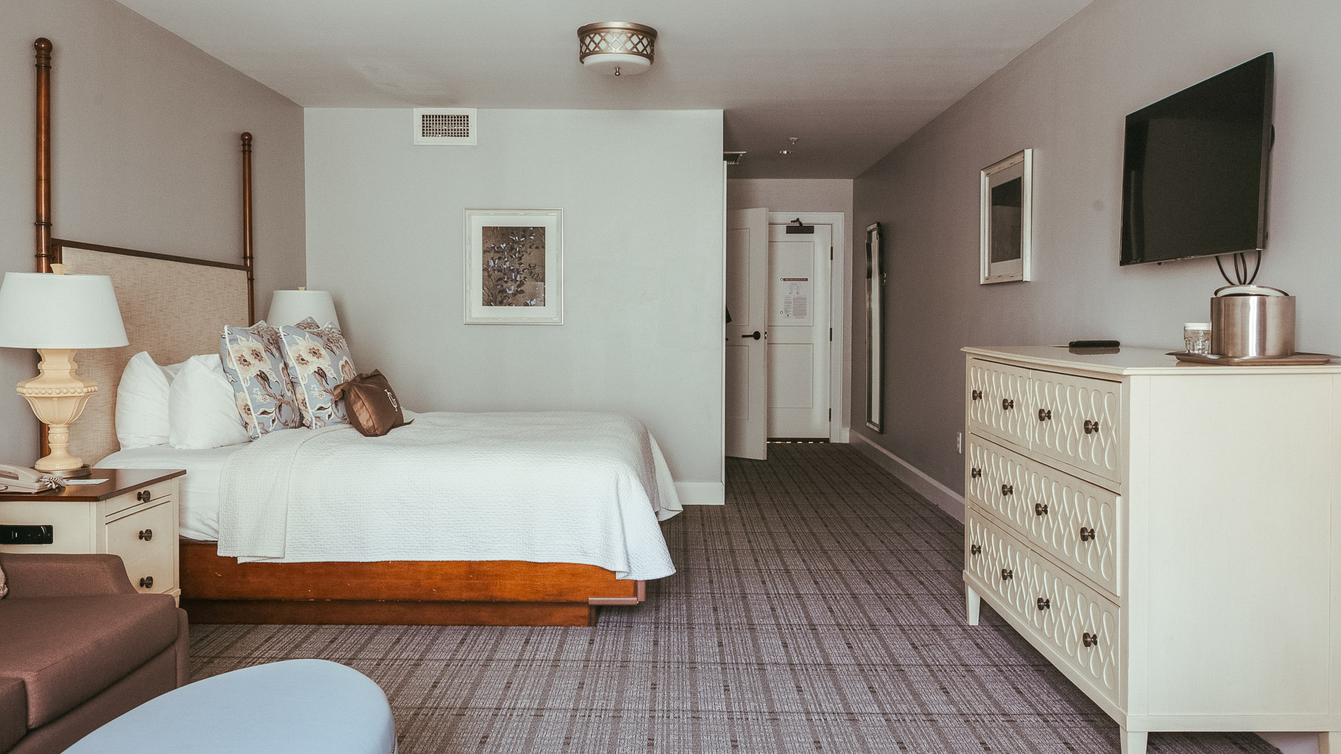 a bedroom with a bed and dresser