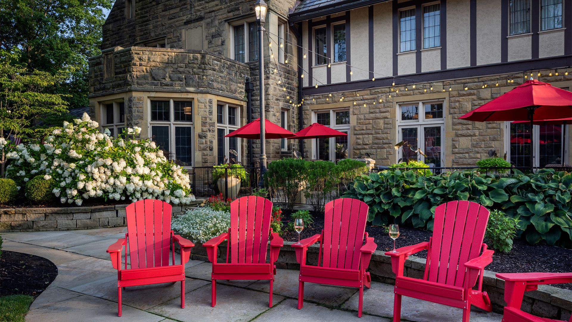 a group of red chairs in front of a building