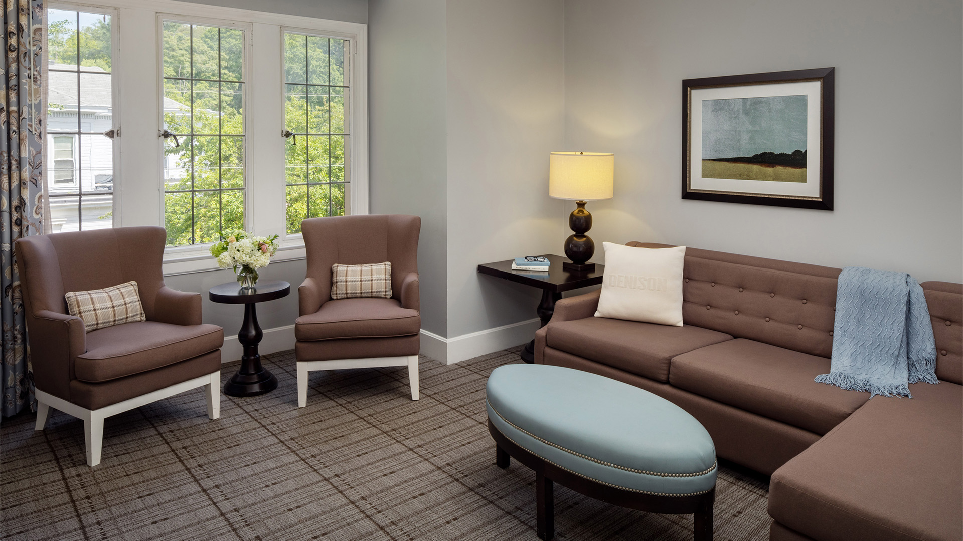 a living room with a couch and chairs