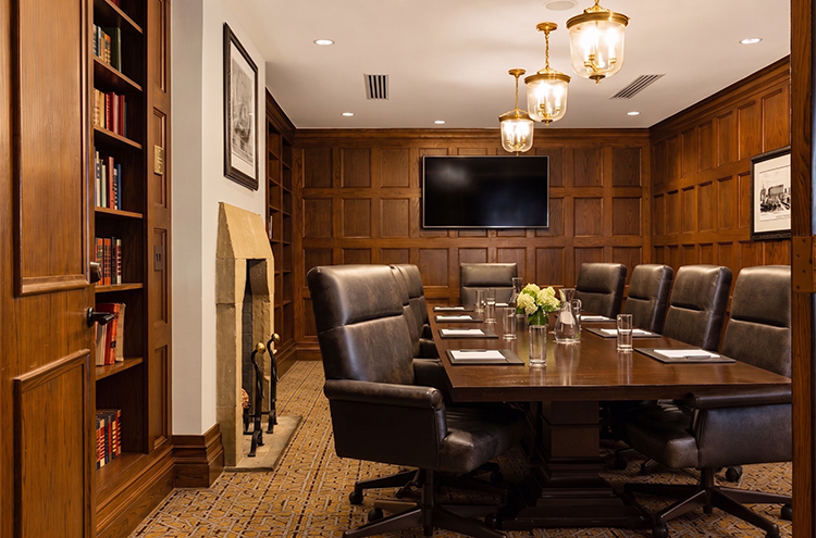 a conference room with a table and chairs