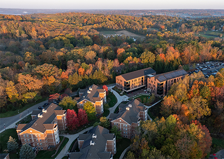 a group of buildings surrounded by trees