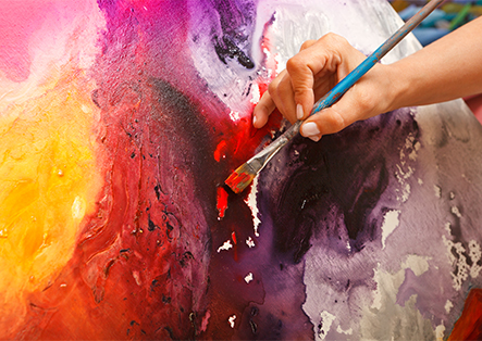 a close-up of a hand painting