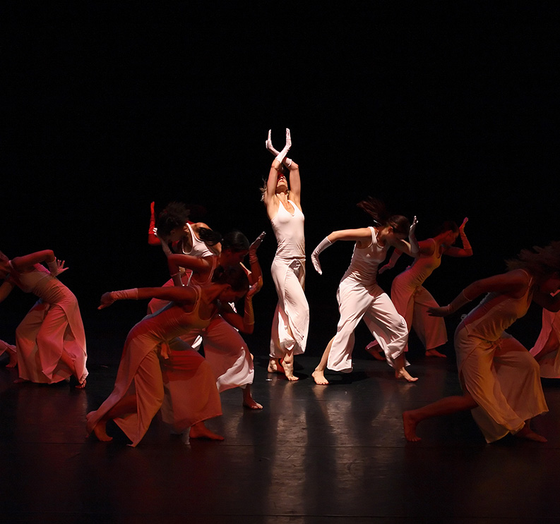 a group of women dancing on a stage
