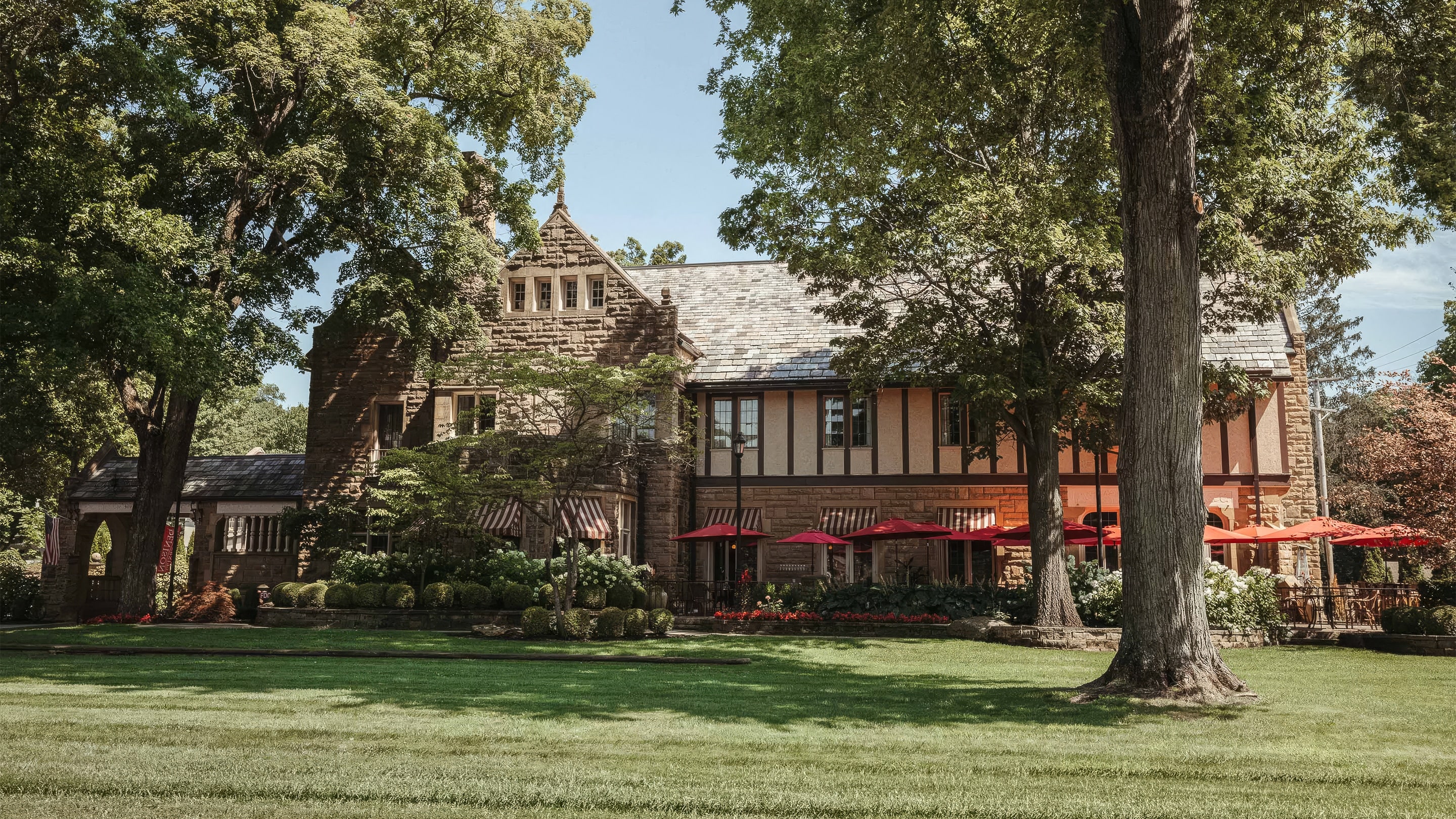 a building with trees and grass