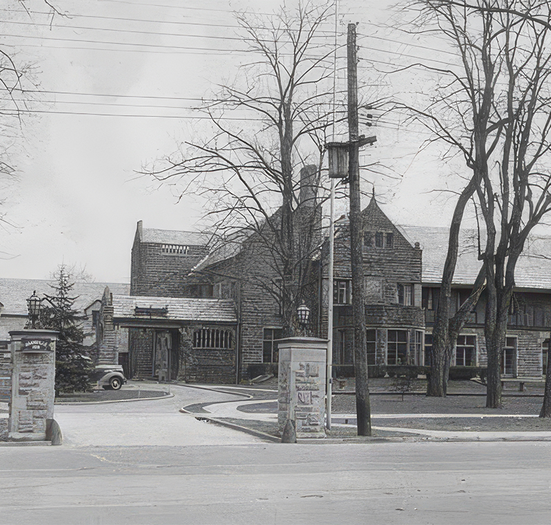 a building with trees and a street light