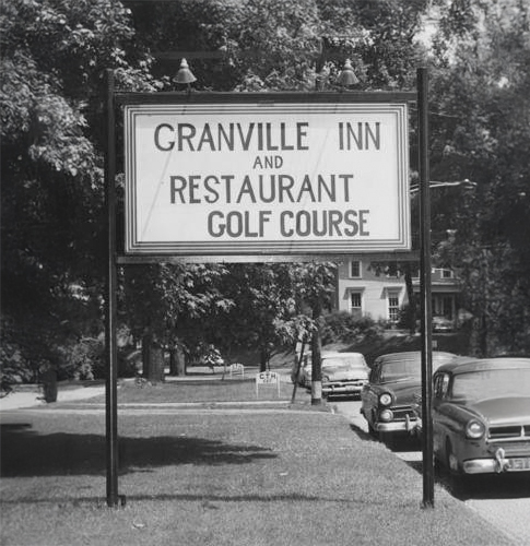 a sign on the side of a road