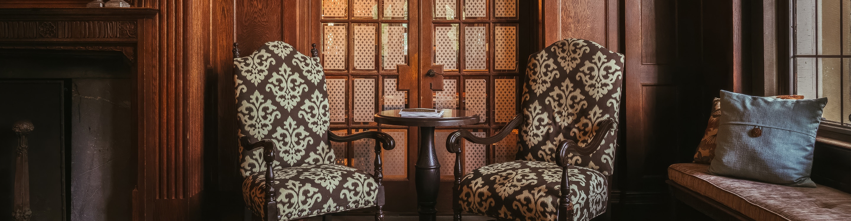 two chairs next to a table