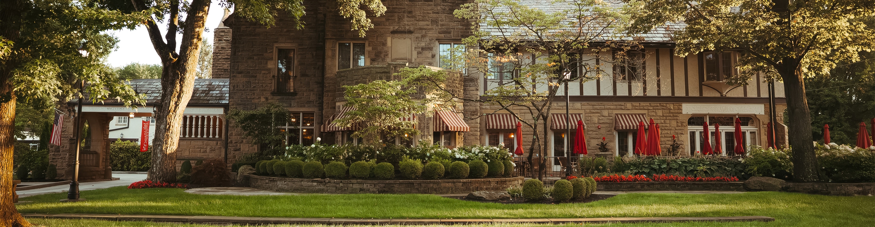 a building with a lawn and trees