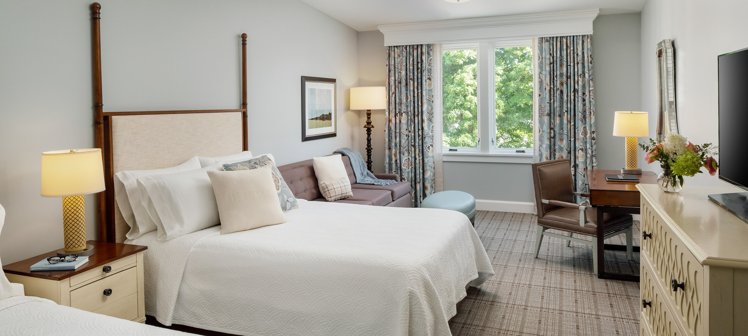 a bedroom with a bed and a couch