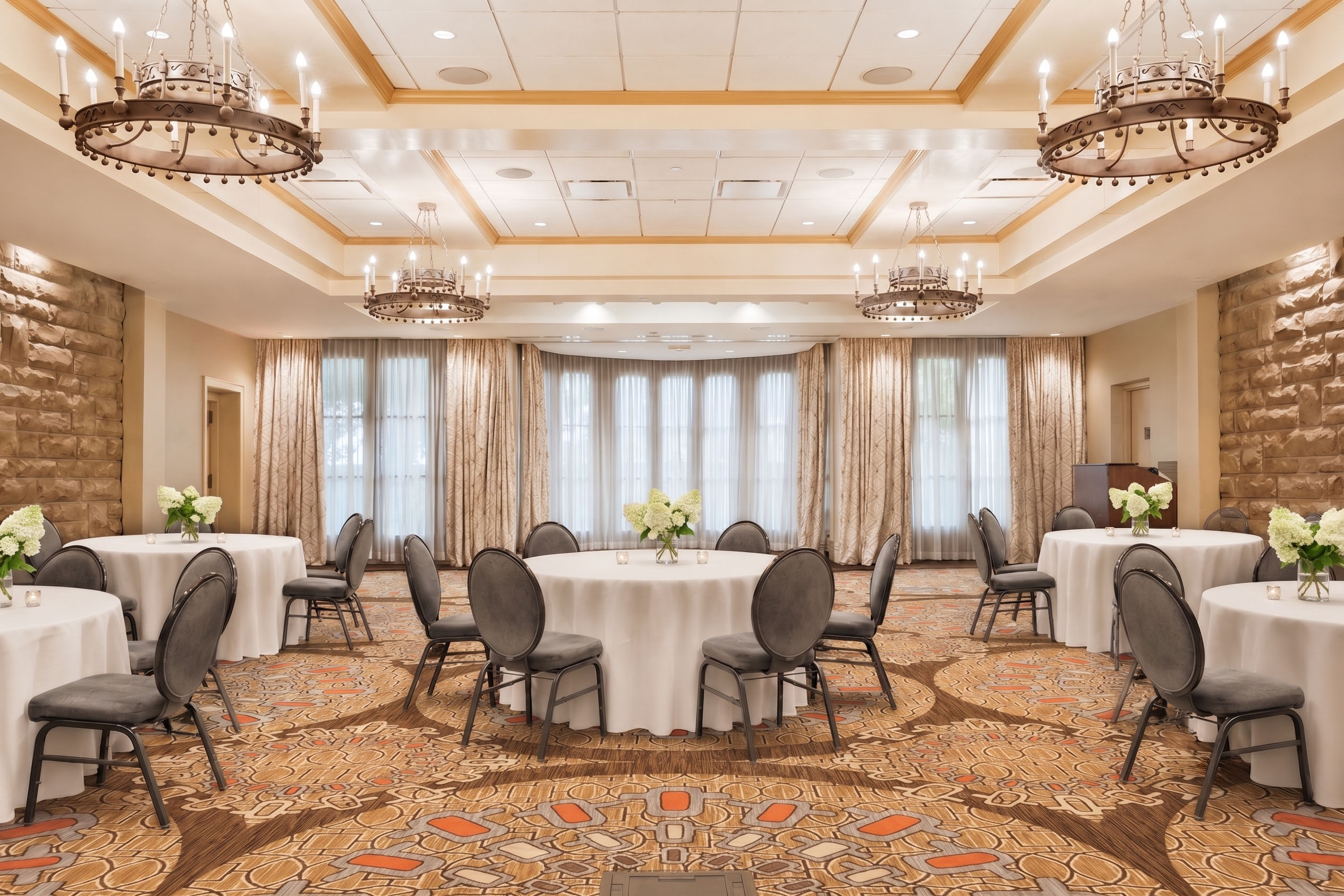 a room with round tables and chairs