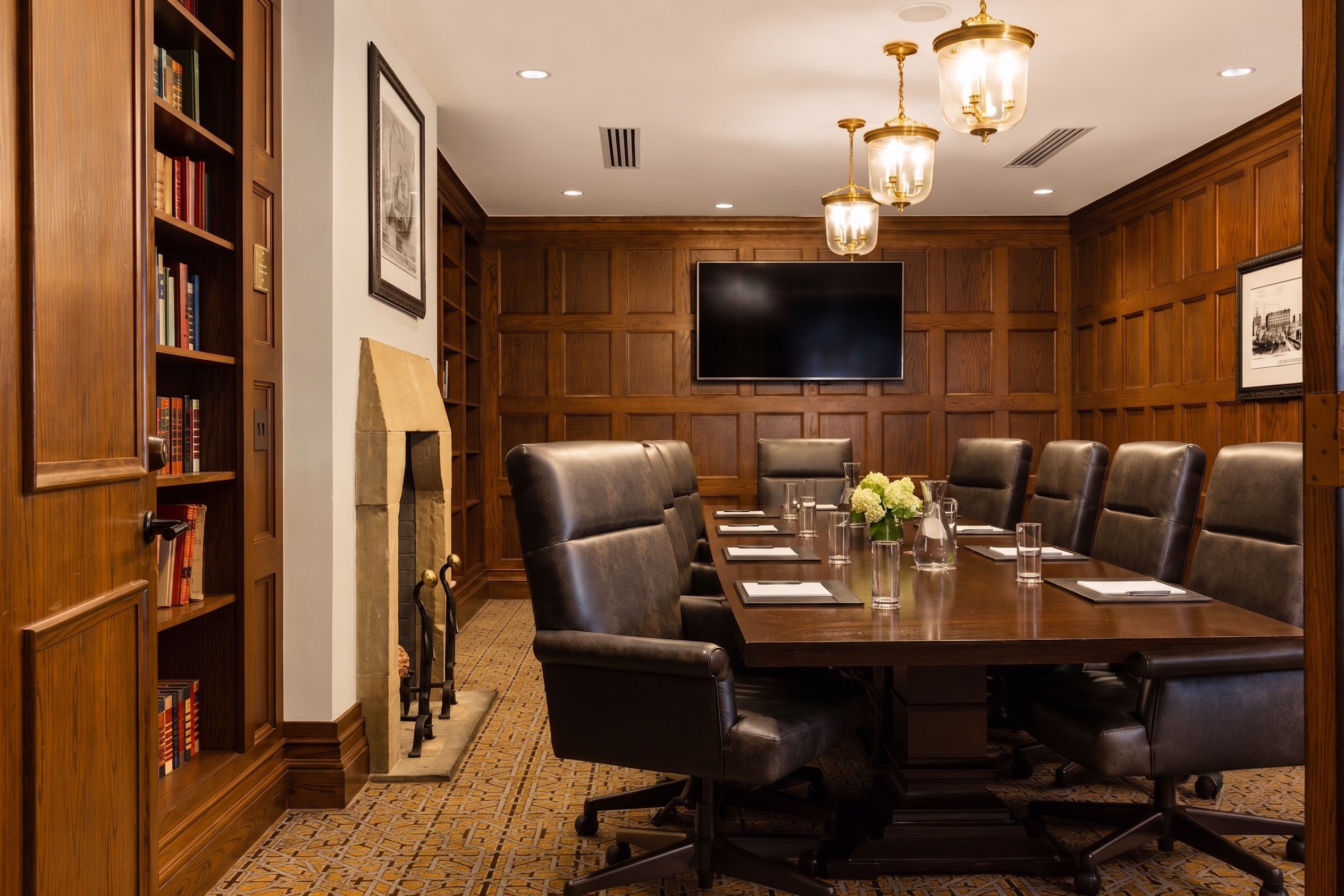 a conference room with a table and chairs