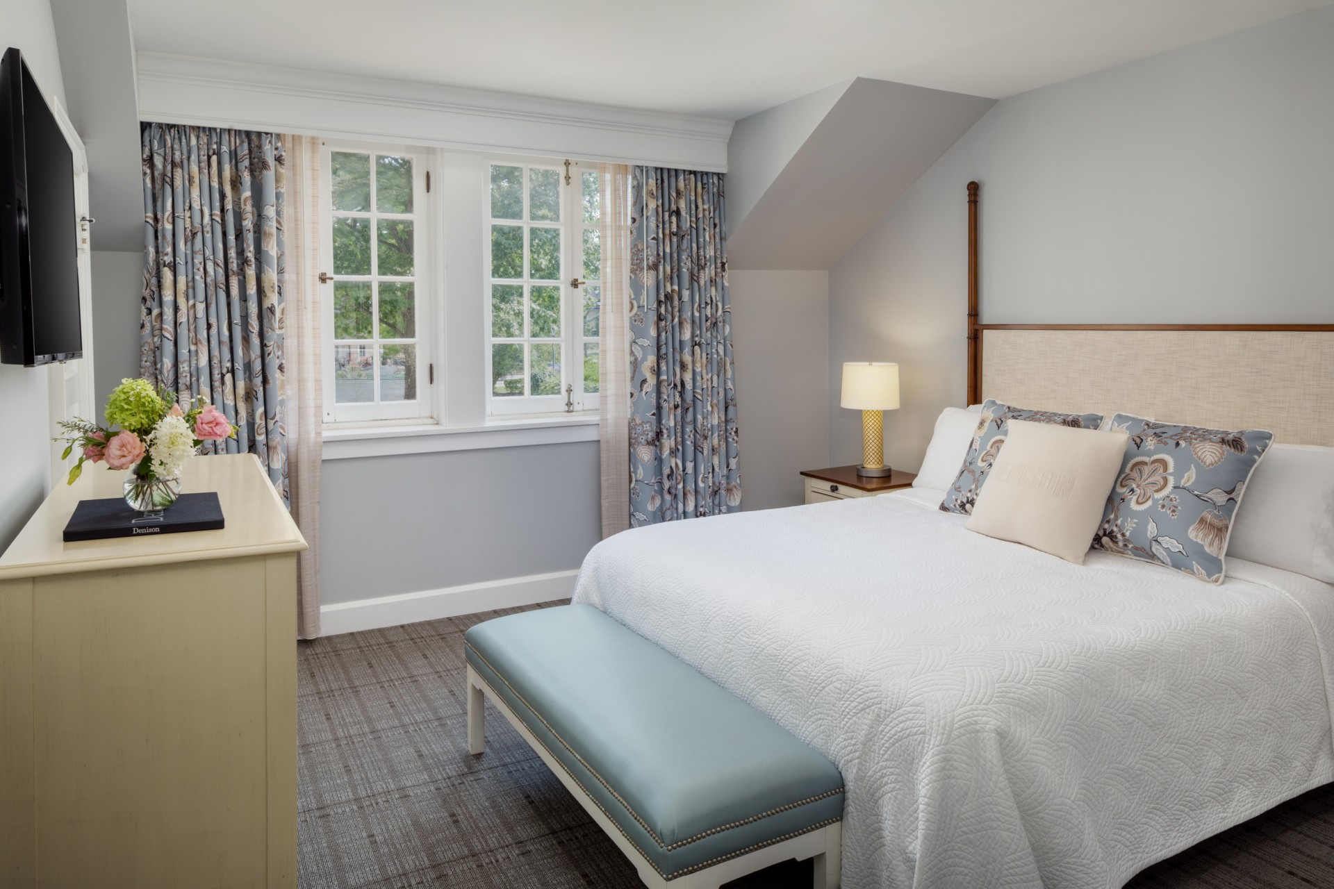 a bedroom with a bed and a desk
