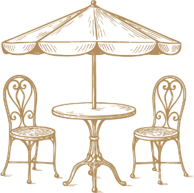 a table and chairs under an umbrella