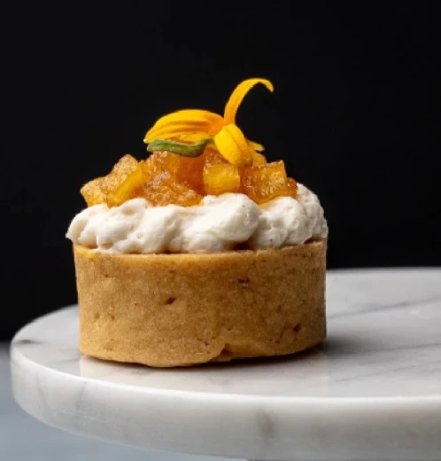 a small dessert on a marble plate