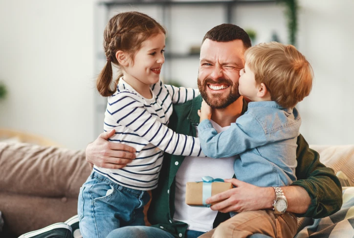 dad hugging kids