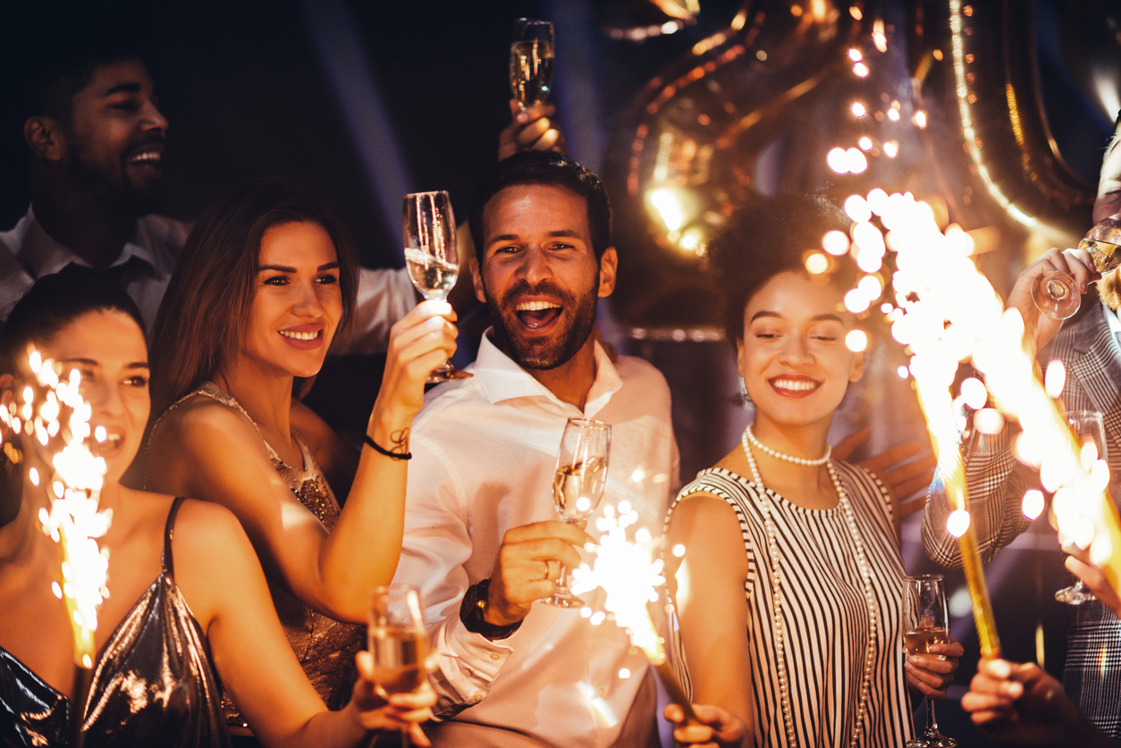 friends celebrating with champaign and sparkles