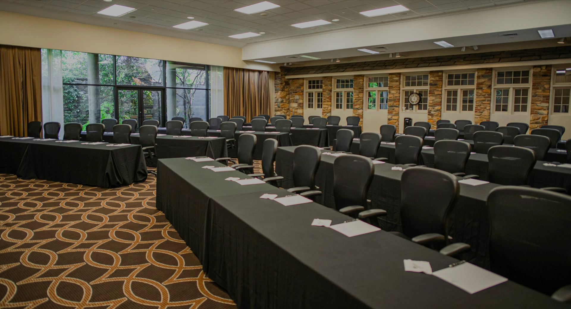 tables set up with papers as a conference 