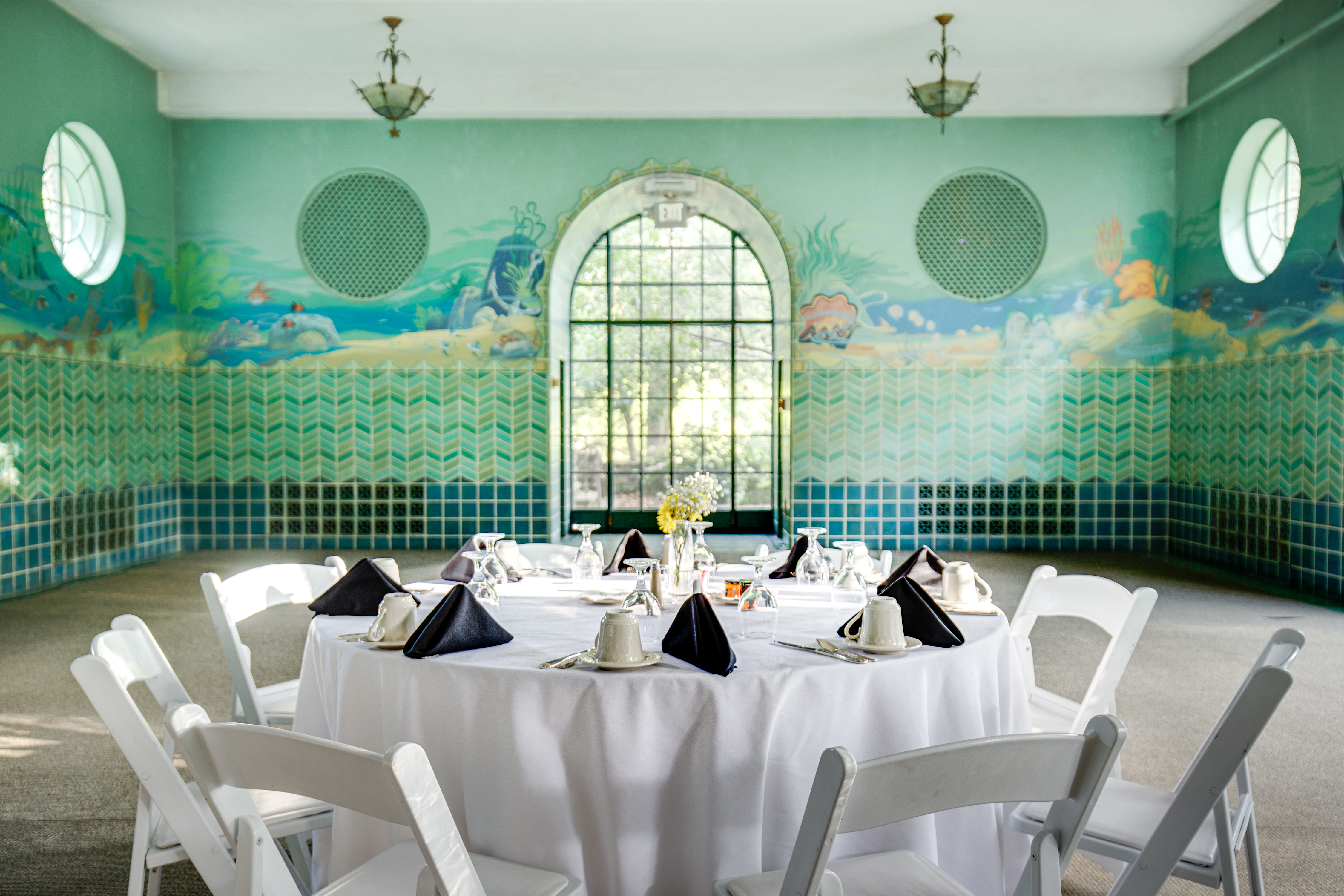 view of a table with table cloth in a blue room