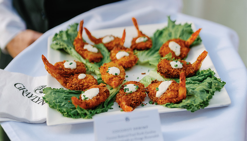 a plate of fried shrimp with lettuce